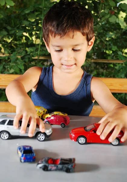 Children playing with cars toys outdoor in summer time — Stock Photo © zurijeta #8848847