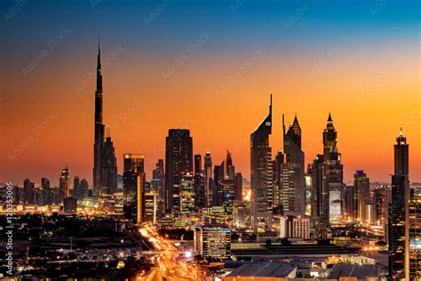 A beautiful Skyline view of Dubai, UAE as seen from Dubai Frame at sunset showing Burj Khalifa ...