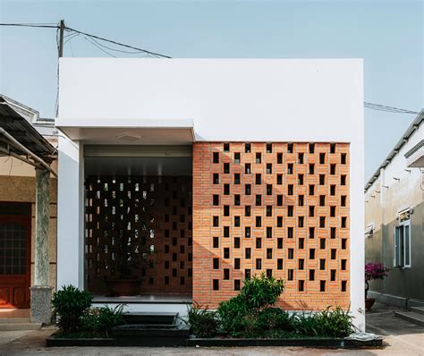 90odesign built this small house with brick walls as a shield of the house in Ho Chi Minh city