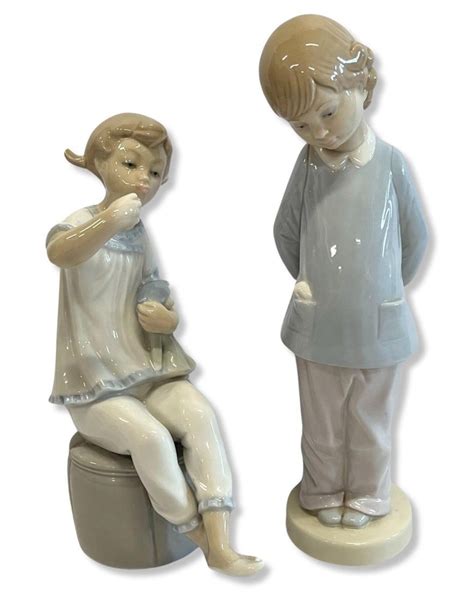 Pair Of Lladro Porcelain Figurines Auction