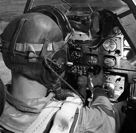 Pilot of a North American P-51 Mustang in cockpit | World War Photos