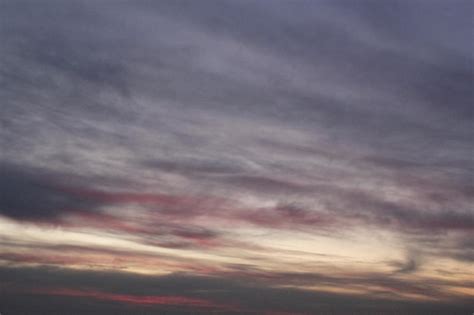 Premium Photo | A sky with clouds and a plane in the sky