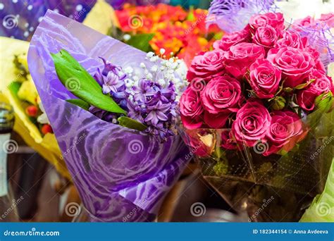 Bouquet of Pink Roses and a Lilac Bouquet at the Anniversary Stock Photo - Image of blossom ...