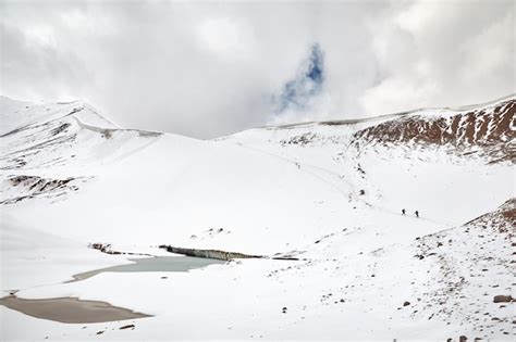 Premium Photo | Hikers in the snowy mountains