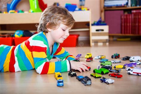 Happy Funny Little Blond Child Playing with Lots of Toy Cars Stock Photo - Image of emotion ...