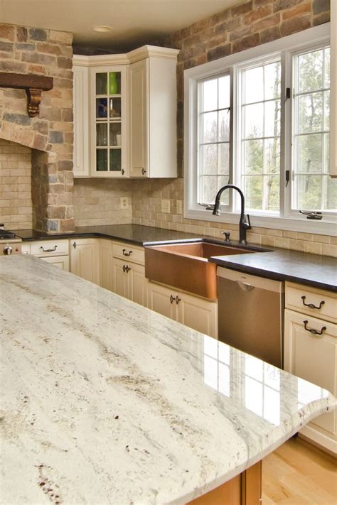 Cream Subway Style Backsplash with Glacier White Granite Countertops