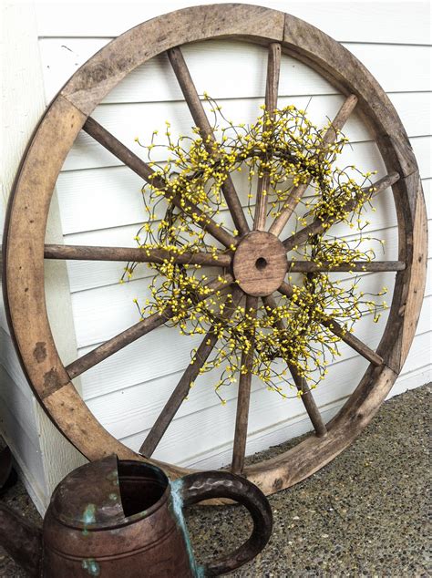 Decor: Old wooden wagon wheel. | Wagon wheel decor, Wheel decor, Wagon wheel