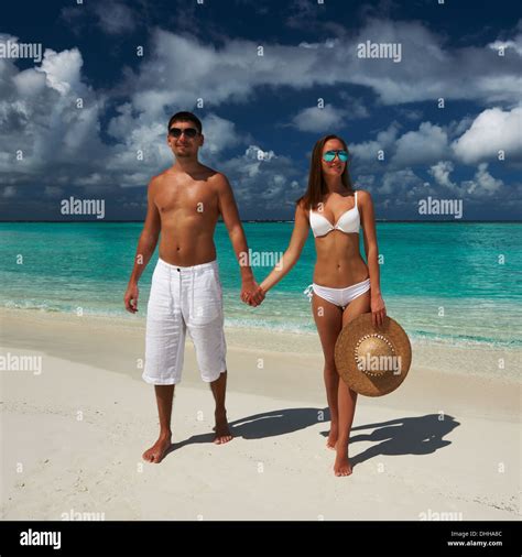 Couple on a beach at Maldives Stock Photo - Alamy