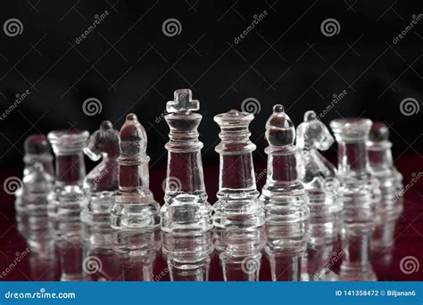 Glass Chess Pieces on Chessboard Stock Photo - Image of black, white: 141358472