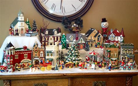 Christmas Snow Village on top of a piece of furniture. Maybe get one a year- kids get one with d ...