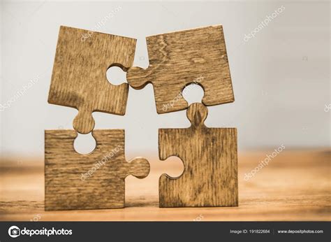 Four Wooden Puzzle Pieces Wooden Background Concept Connection People — Stock Photo © borjomi88 ...