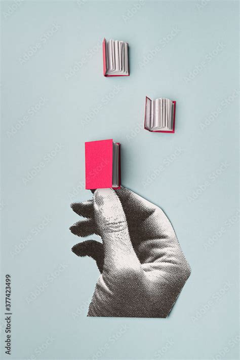 Hand holding a book Stock Photo | Adobe Stock