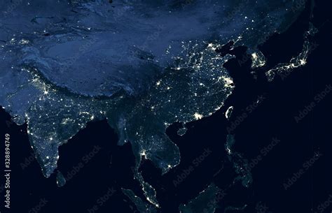 Earth at night, world map on satellite photo. City lights showing human activity in India, China ...