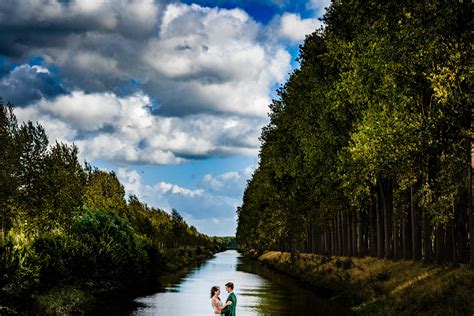 Cropped couple portrait in river landscape, photo by Kristof Claeys Photography