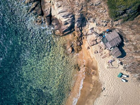 Premium Photo | Man in hammock on a beach aerial view