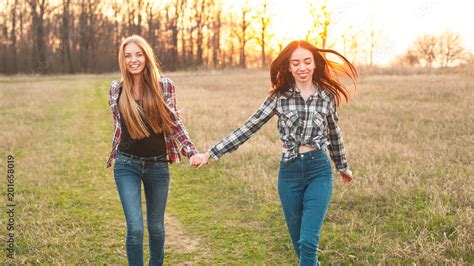 Two Friends Walking In The Sunset