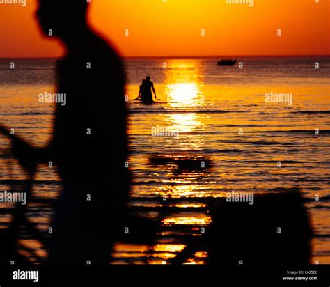 Sunset and bicycle silhouette Stock Photo - Alamy