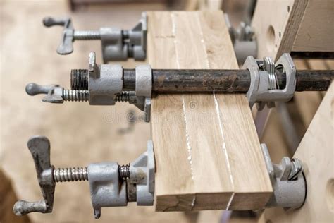 Using Clamps and Glue To Connect Wooden Timbers for Furniture Detail ...