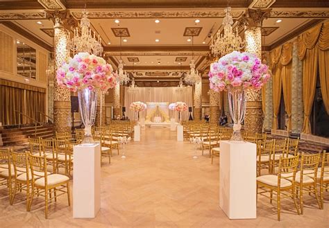 Ceremony Décor Photos - Aisle Framed by Pink and White Rose Centerpieces - Inside Weddings