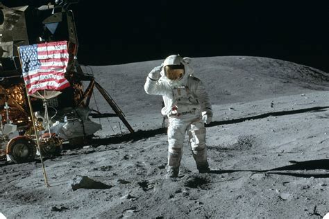 Neil Armstrong On The Moon Holding Flag