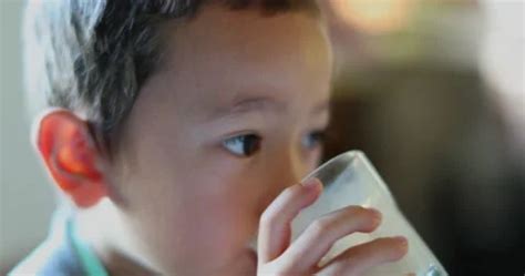 Kids drinking milk | Stock Video | Pond5