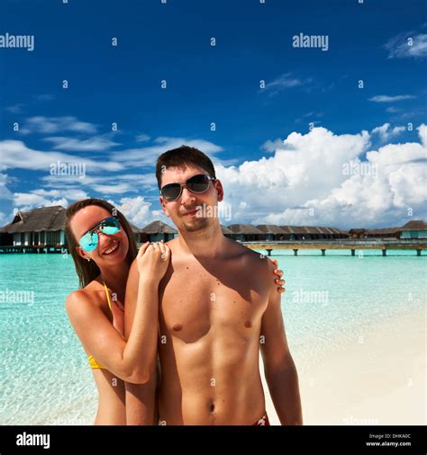 Couple on a beach at Maldives Stock Photo - Alamy