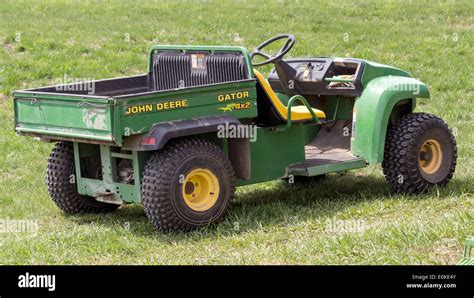 John Deere Gator four wheeler ATV with dump Stock Photo - Alamy