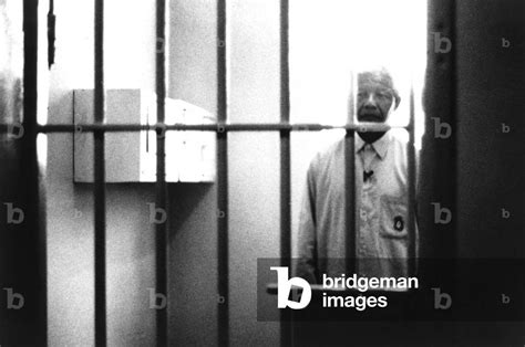 Image of Nelson Mandela visiting his former prison cell at Robben Island,