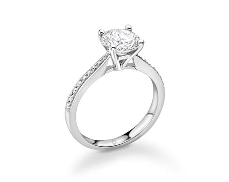 18K WHITE GOLD 4 PRONG DIAMOND ENGAGEMENT RING WITH SIDE STONES IN PRONG SET