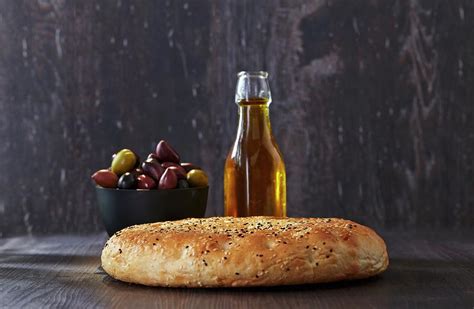 Unleavened Bread, Olives And A Bottle Of Olive Oil Photograph by Christopher Mick - Fine Art America