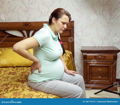 Pregnant Woman Back Pain. Pregnant in Her Bedroom Stock Photo - Image of torso, pregnancy: 186774770