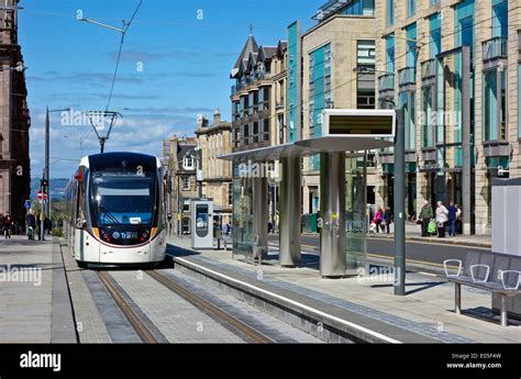 Edinburgh tram at St. Andrew Square stop in Edinburgh Scotland and heading towards Airport Stock ...