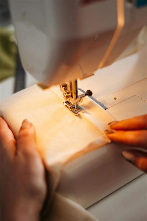 Person Sewing a Fabric · Free Stock Photo