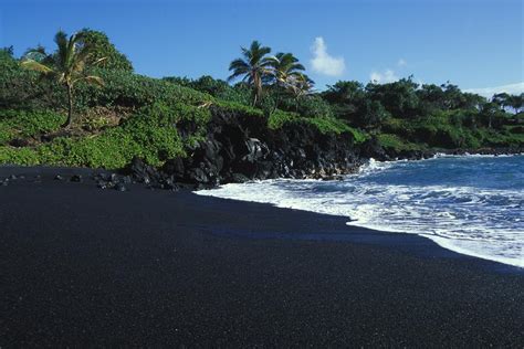 Black Volcanic Sand Beach On Hawaiis Photograph by Paul Nicklen