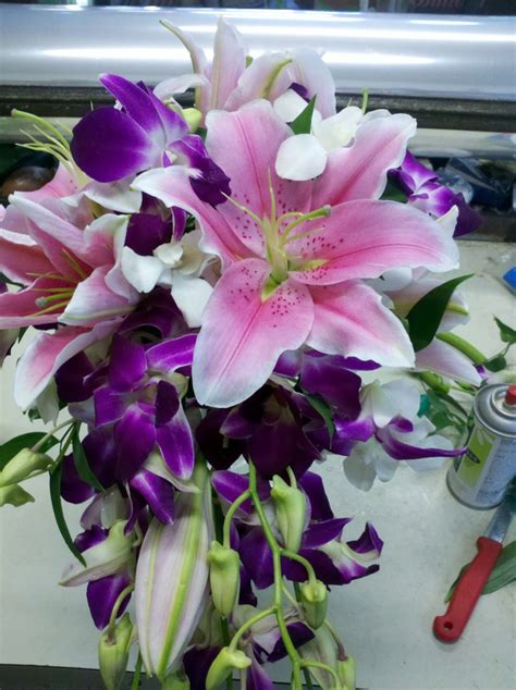 Cascadinf Wedding Bouquet with stargazer lilies, fushia demdrobium orchids | Wedding bouquets ...