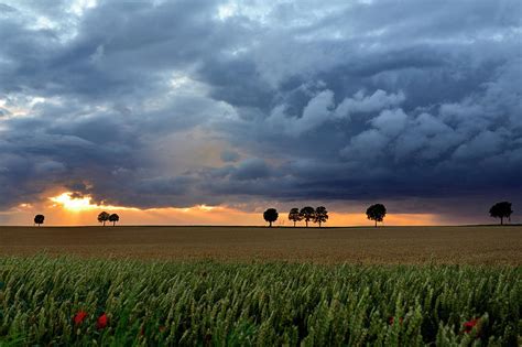 Summer Sunset With Storm Clouds by Pierre Hanquin Photographie