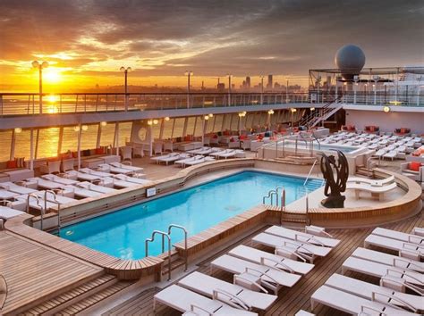 the sun is setting over an outdoor swimming pool on a cruise ship in the ocean