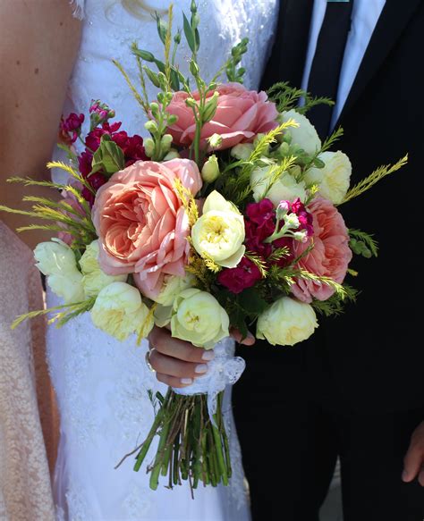 Romantic bridal bouquet: antique pink cabbage roses, ivory mini garden roses, raspberry pink ...