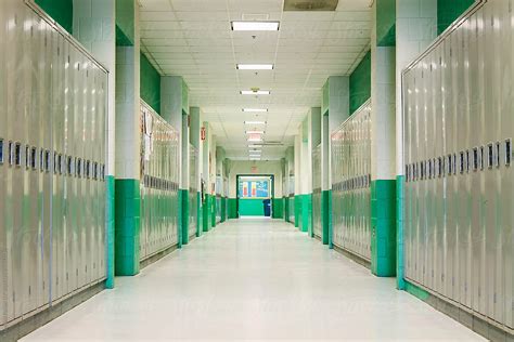 "School Hallway With Lockers" by Stocksy Contributor "Raymond Forbes LLC" - Stocksy