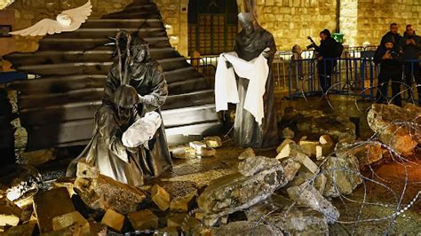 KTemoc Konsiders ........: Bethlehem nativity scene depicted with rubble and razor wire