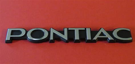 NEW 1982-1990 Pontiac Firebird Headlight Door Emblem-Badge