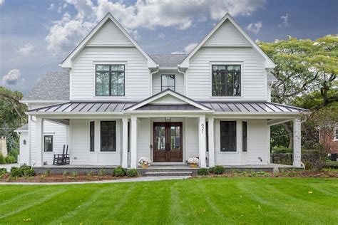 Beautiful white modern farmhouse with black windows and metal roof and front porch | Farmhouse ...