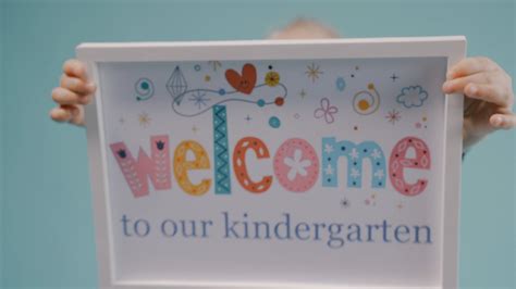 A Kindergarten Child Showing a Signage · Free Stock Video