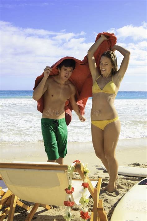 Young Couple at the Beach in Hawaii Stock Photo - Image of pretty, towel: 23021934