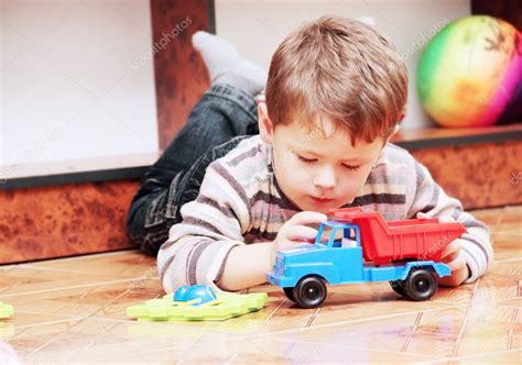 Little Boy Playing with Toy Car — Stock Photo © nataliia #7441288