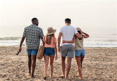 "Friends Walking On The Beach" by Stocksy Contributor "Pedro Merino" - Stocksy