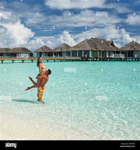 Couple on a beach at Maldives Stock Photo - Alamy