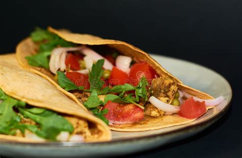 Plate with Mexican Cuisine, Large Tacos with Vegetables and Meat on Black Background. Stock ...