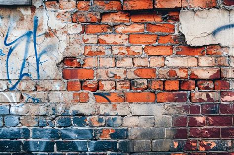 Brick Wall with Graffiti and Cracks Stock Image - Image of brickwork, white: 303746319