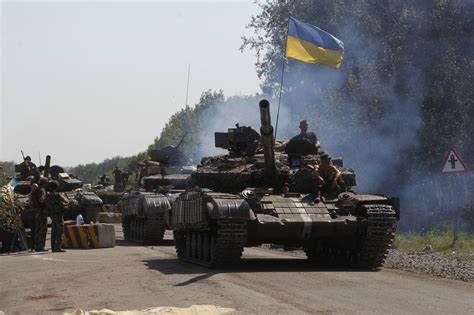 Russia: Hundreds of Ukraine troops defect at border as Moscow begins military drill - CBS News